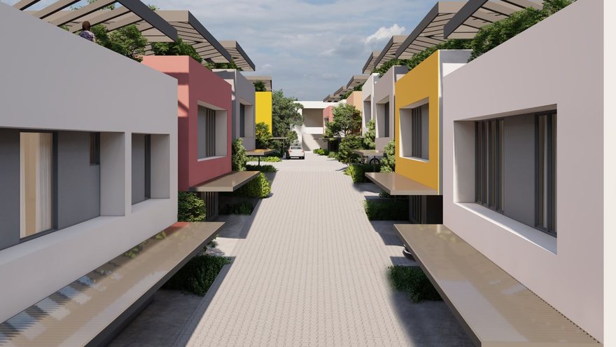 Internal street in daylight framed by accent façades